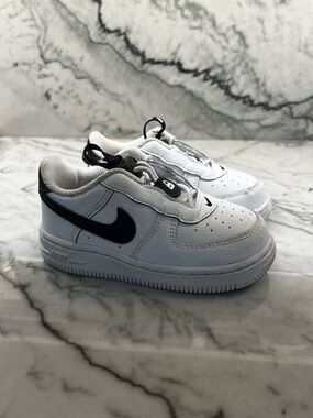 Nike Kids White Sneakers with Black Swoosh